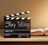Storytelling — a film clapperboard over an open book
